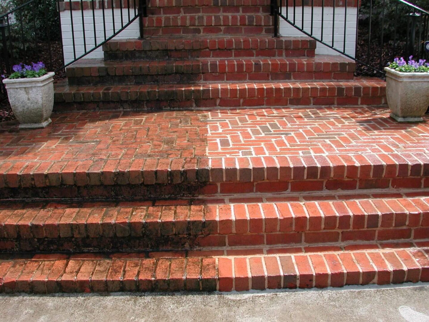 A brick staircase with steps and railings.